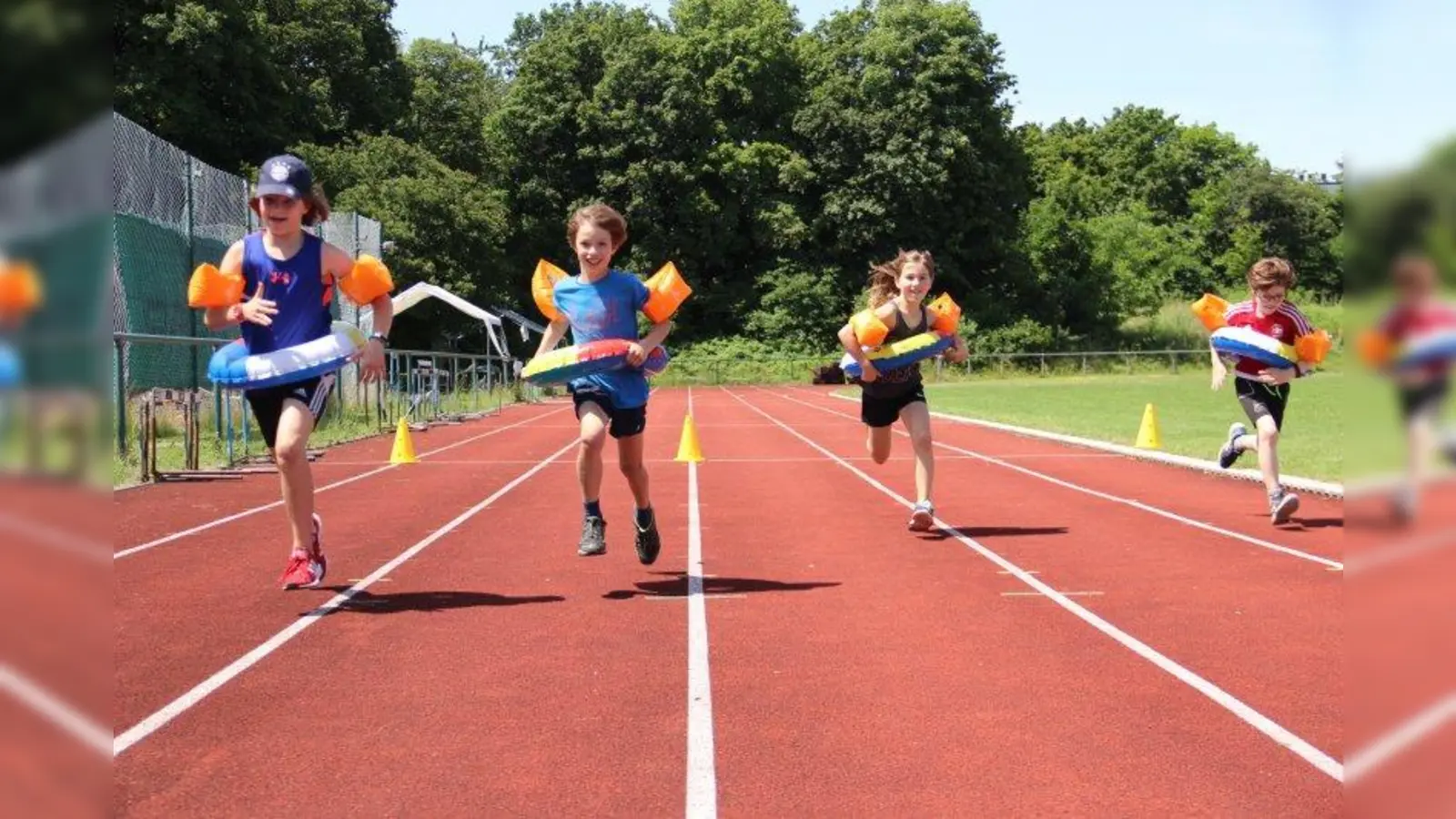 „Sprint zum Badesee mit Schwimmflügeln und Schwimmreifen” war eine der Disziplinen bei der Spaßolympiade der Werdenfelsschule. (Foto: Gliesche)